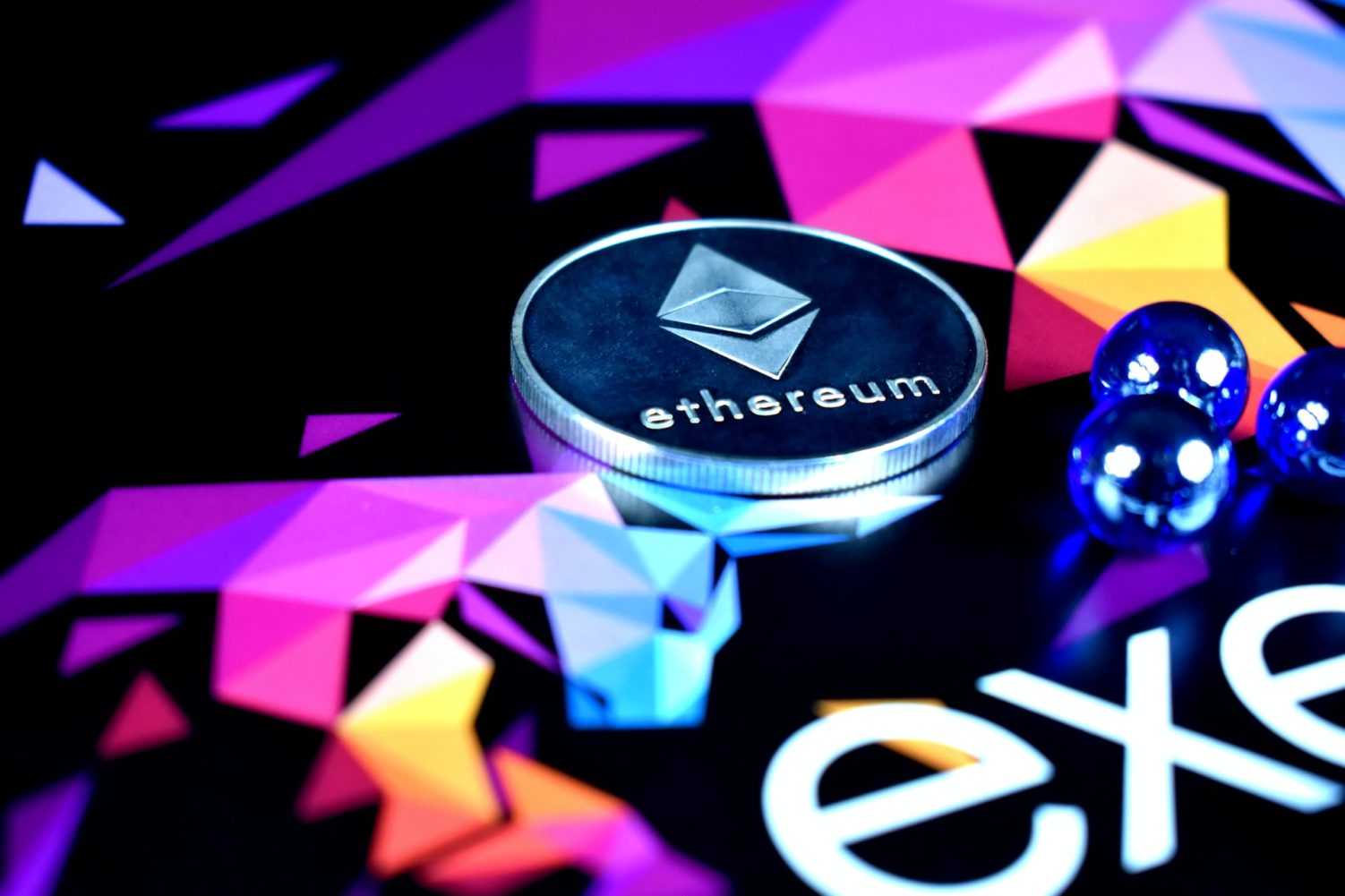 Ethereum is illustrated as a silver coin with colorful background.