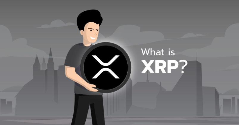 Man holding an XRP coin to illustrate the topic of what is ripple xrp