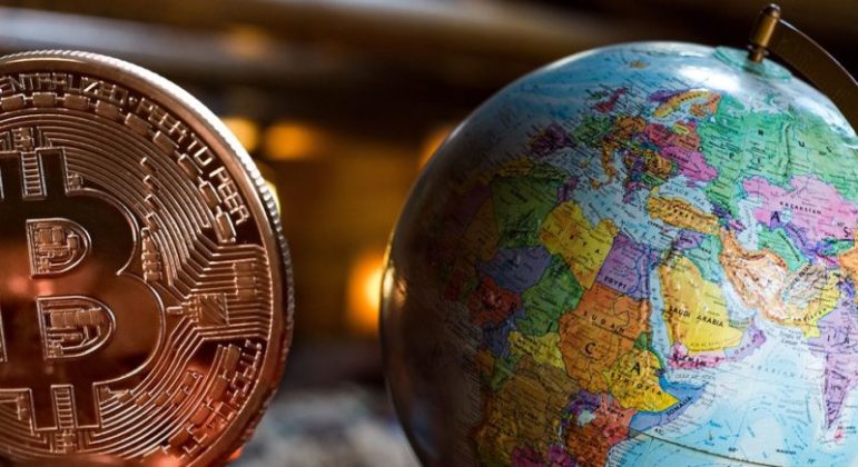 Bitcoin next to a globe atlas cryptocurrency NZ New Zealand