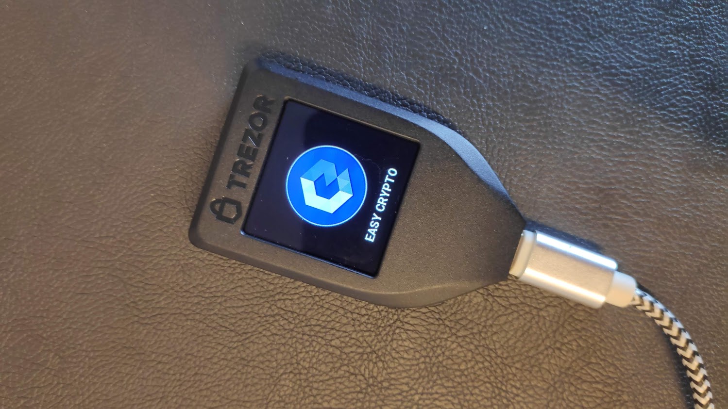 Photo of a Trezor Model T with the Easy Crypto Logo on the screen to illustrate one of the best bitcoin wallets in New Zealand