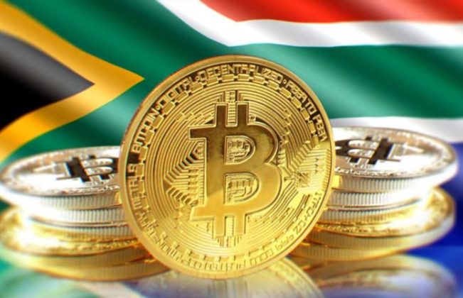 Bitcoin (BTC) is illustrated as physical gold coins with the national flag of South Africa on the background