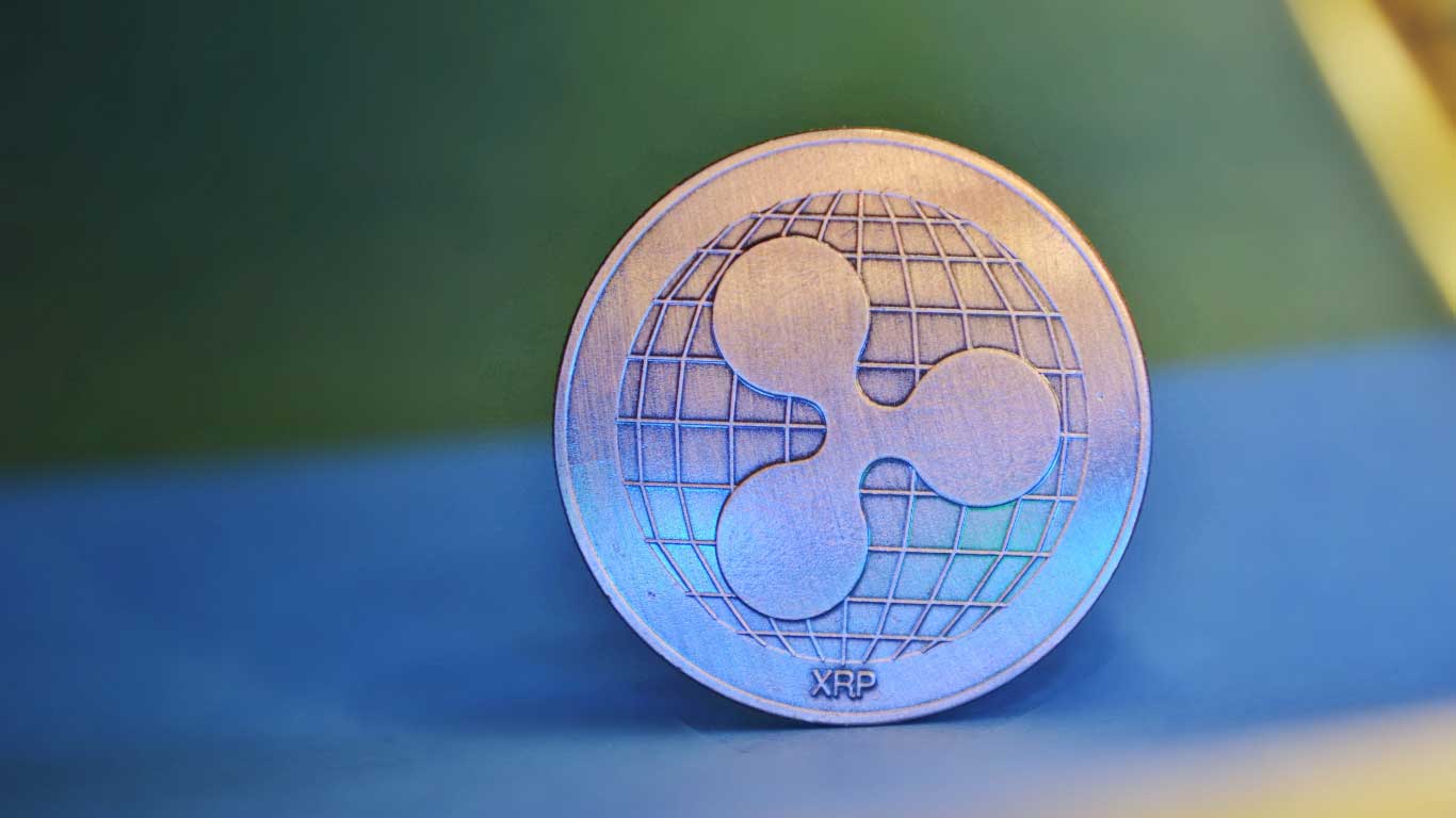 The illustration of a Ripple (XRP) token
