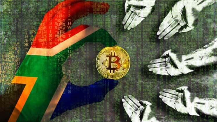 A hand painted in South Africa's national flag color is holding a physical Bitcoin with other hands