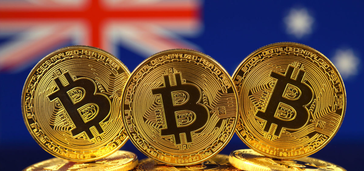 Physical gold Bitcoin with Australia’s flag on the background