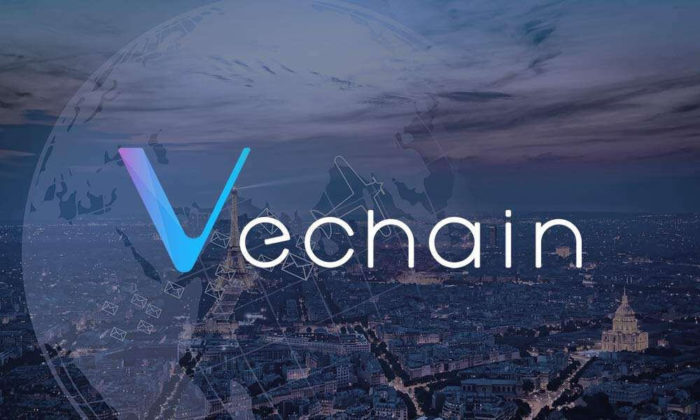 The logo of VeChain (VET) with city landscape picture on background