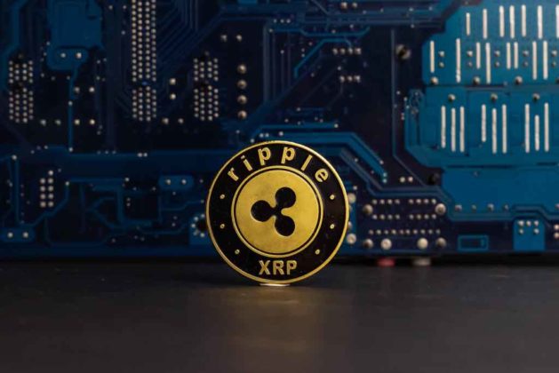 Ripple (XRP) token is illustrated as a physical coin