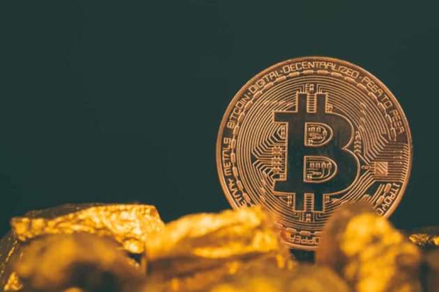 Physical gold Bitcoin with dark-black background