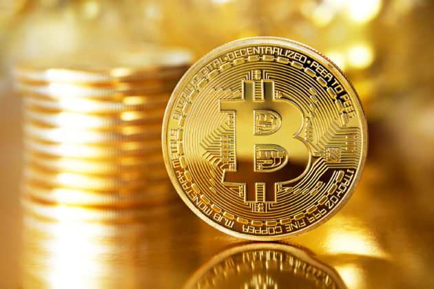 Illustration of physical Bitcoin with gold color