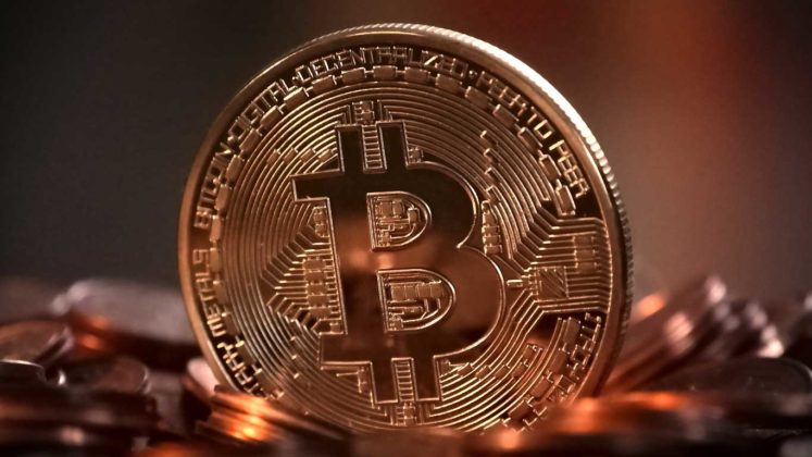 Bitcoin (BTC) is illustrated as physical copper coins