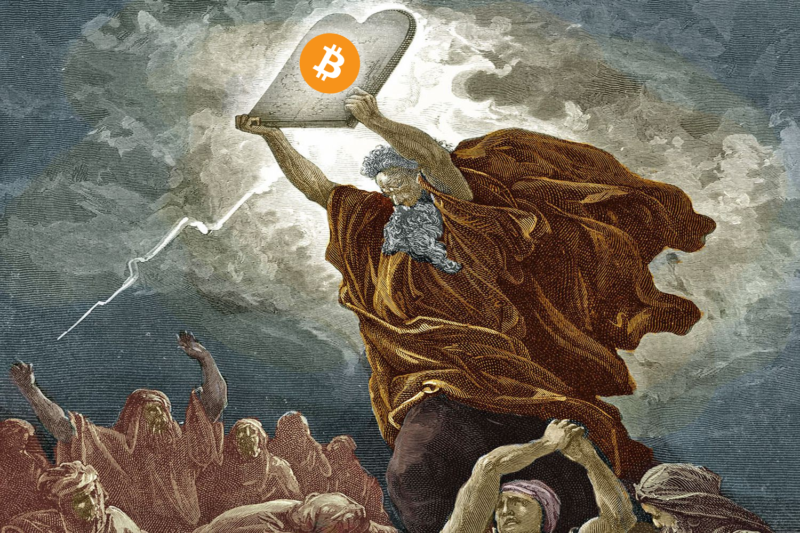 Bitcoin slate being help up by man  with white beard