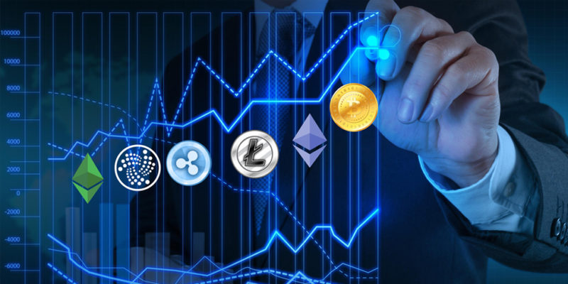 Ripple XRP coin logo with other cryptocurrencies on a graph being drawn by a suited man to represent XRP coin predictions