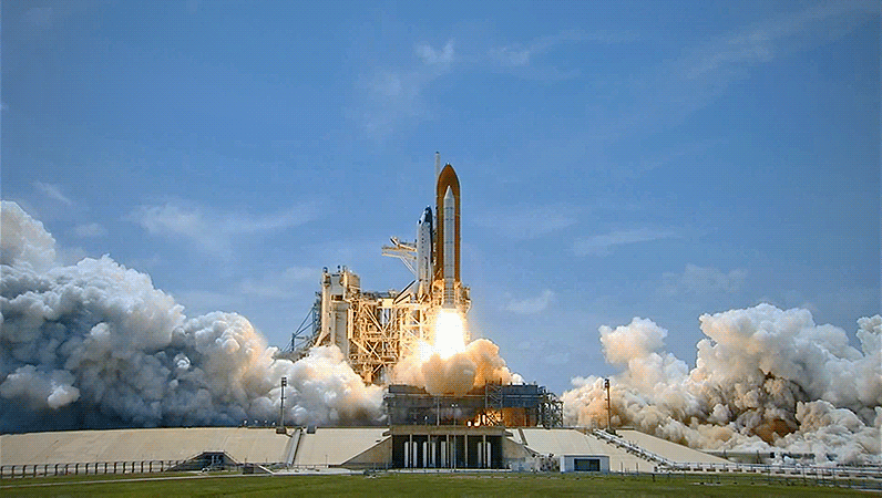 Rocketship launching with clear skies and smoke clouds gif