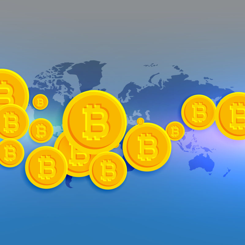 pixel bitcoins on top of a purple and grey world map