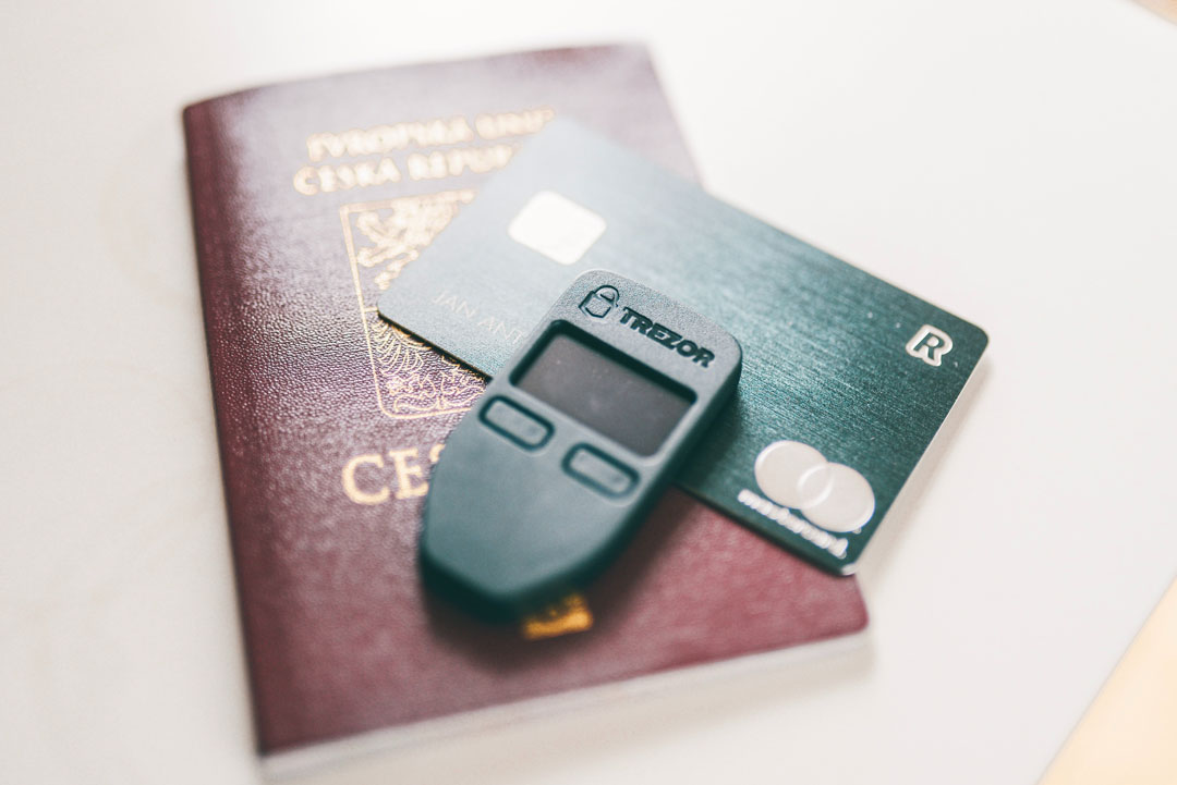 Trezor Model S on top of a credit card.