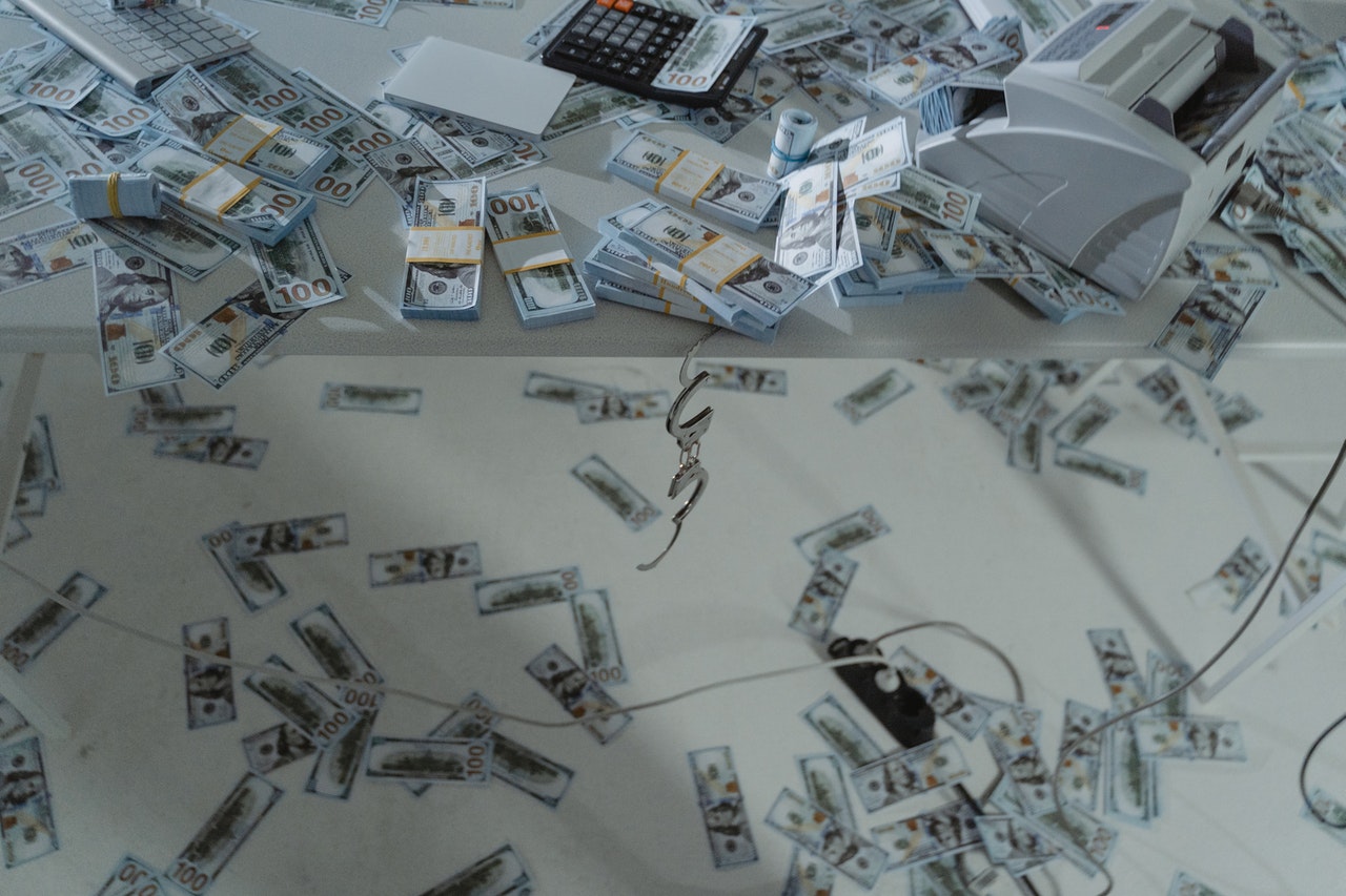 Photo of cash being scattered to illustrate the idea of a crypto money mule