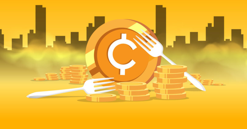 Illustration of 3 crypto coins with 2 forks on top to illustrate the idea of what are crypto forks.