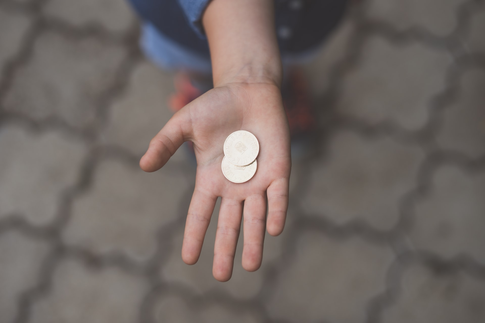 Child holding a coin token.