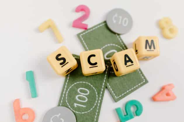Letters spelling scam to illustrate the topic of how to avoid social media scams.