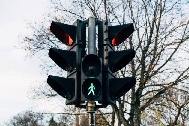 Two traffic lights and a pedestrian light