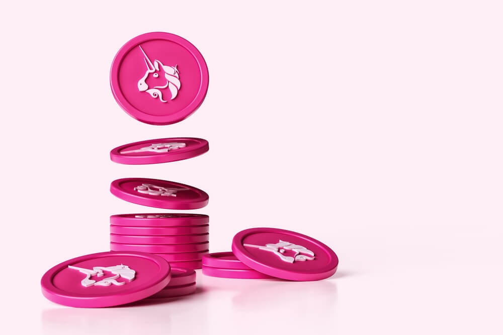 Uniswap (UNI) tokens on pink background.